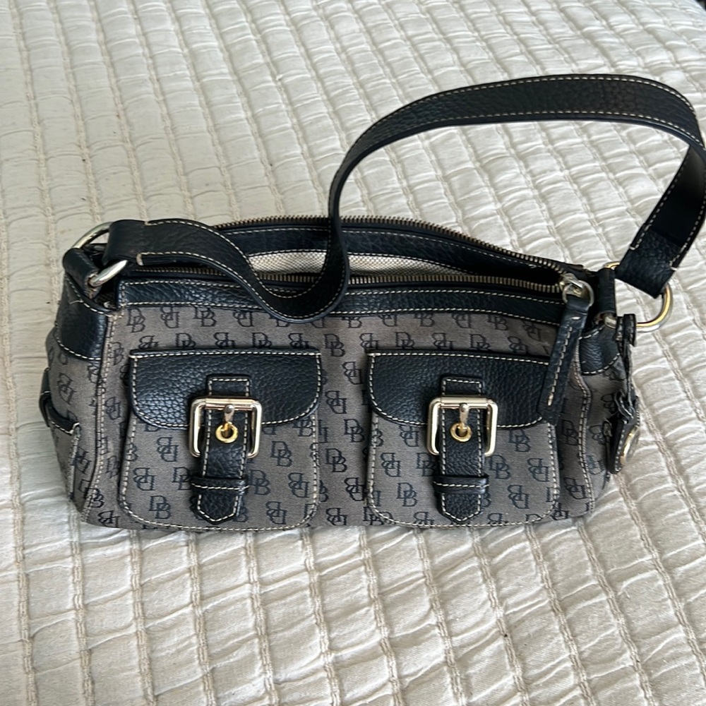 Dooney and Burke hand bag. Very loved bag that is ready to find its new owner